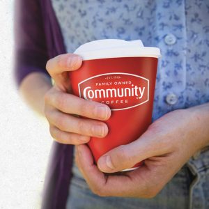 Hands holding a Stanpac new T Cup Series